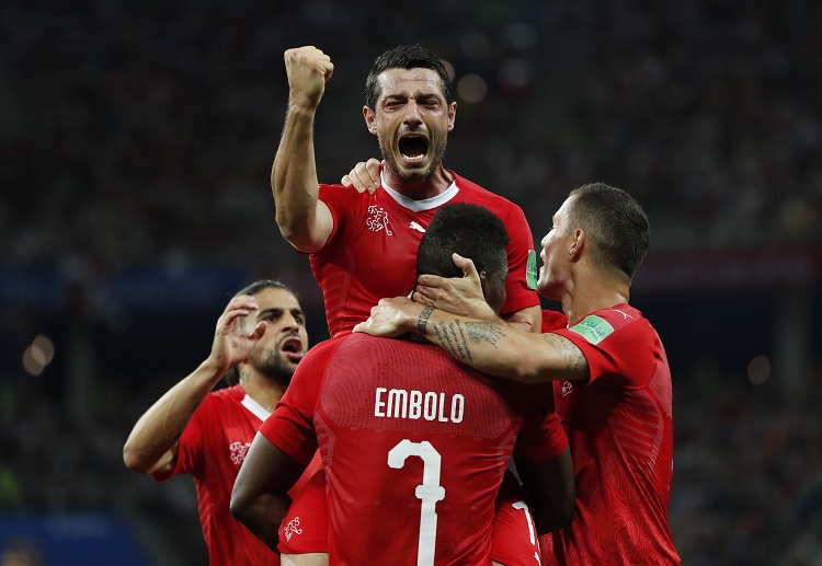 Blerim Dzemaili celebrates his goal as his team eventually advance to the next round of FIFA 2018