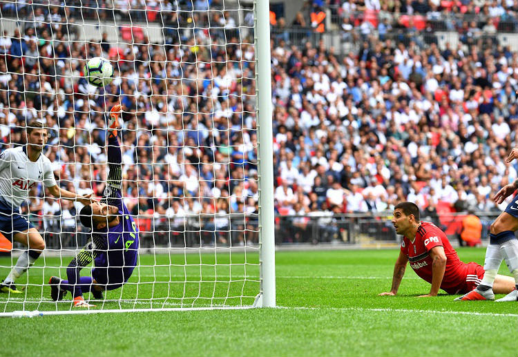 Aleksandar Mitrovic heads past Hugo Lloris in their Premier League game