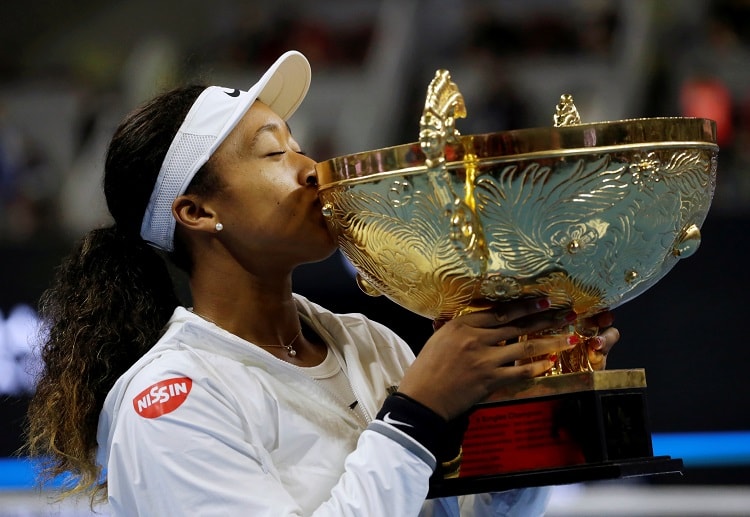 Naomi Osaka celebrates after beating world number one Ashleigh Barty in the China Open