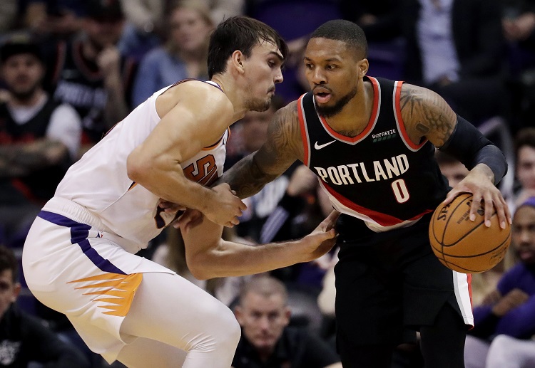 The Trail Blazers celebrate as they pulled off a dramatic one-point NBA win over the Suns