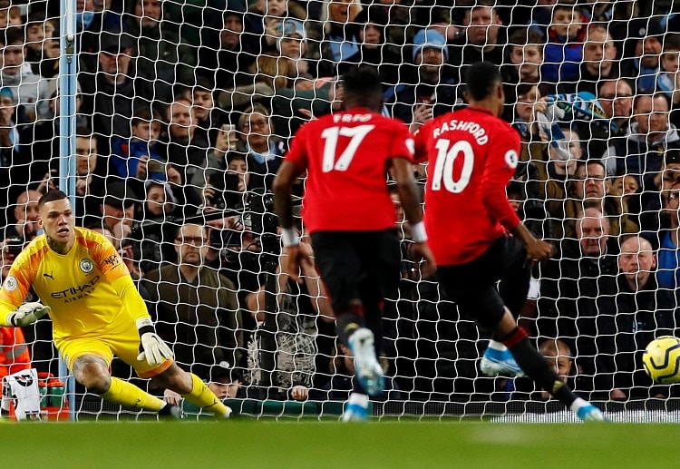 Marcus Rashford scores the opening goal during the Manchester Derby at the Etihad Stadium