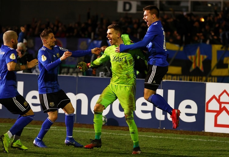 FC Saarbrucken keeper Daniel Batz celebrates after his side reached the next phase of DFB-Pokal