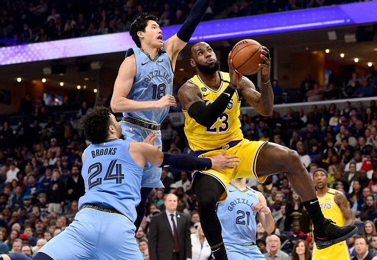 Lakers star player LeBron James shoots the ball against the Memphis Grizzlies in the NBA