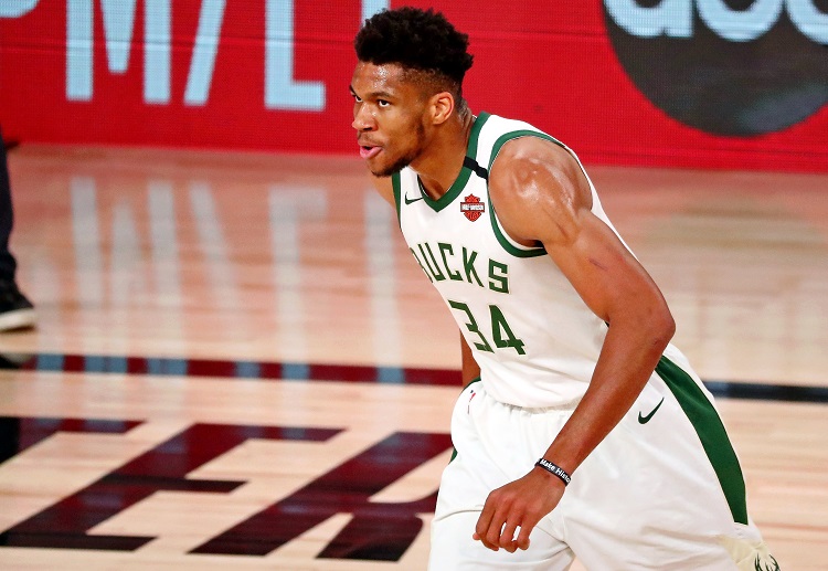 NBA: Milwaukee Bucks lose to Miami Heat 103-94 as injured Giannis Antetokounmpo watched from the bench