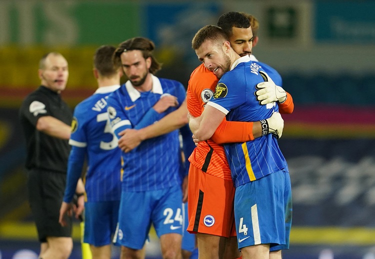 Brighton's Adam Webster celebrates with teammates after a huge win vs Leeds in the Premier League