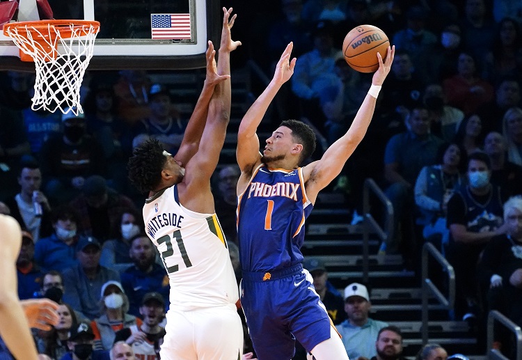 Devin Booker had 19 points in the first half to power the Suns to their 7th straight win in the NBA