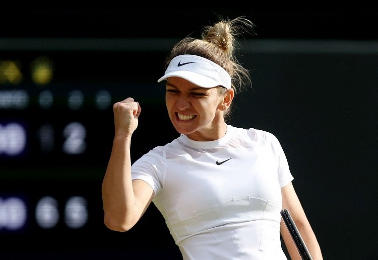 Simona Halep celebrates winning her Wimbledon match against Paula Badosa