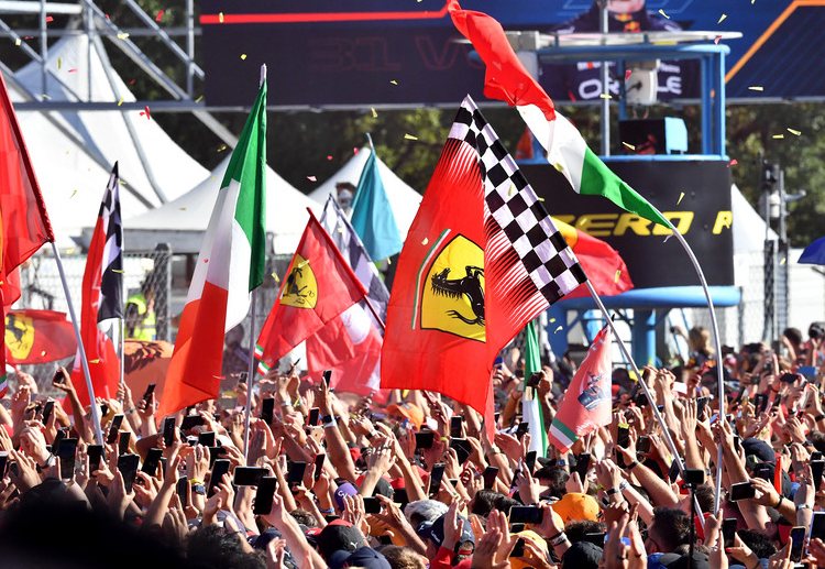 Tifosi celebrate after Charles Leclerc takes the second podium in the 2022 Italian Grand Prix