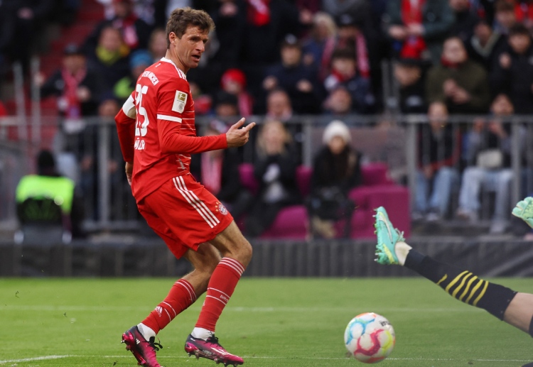 Thomas Muller has scored two goals in the first half for Bayern Munich against Borussia Dortmund in the Bundesliga
