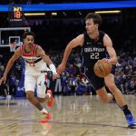 Magic forward Franz Wagner heads to the basket, defended by Wizards guard Jordan Poole in their NBA clash